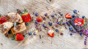 gluten free roll and fruit on serving board